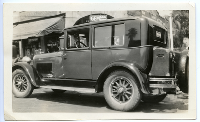 Black automobile with Hoover bumper sticker