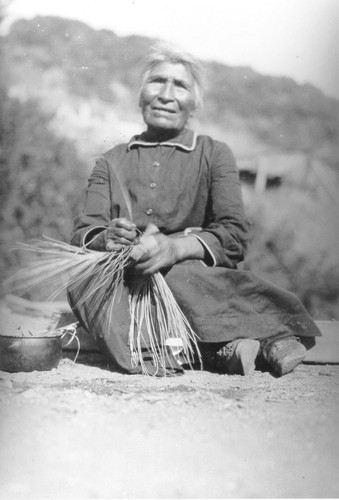 Requa: Mary Ann Frank, working on a basket. Passage on reverse reads:--Mary Ann Frank Roberts mother