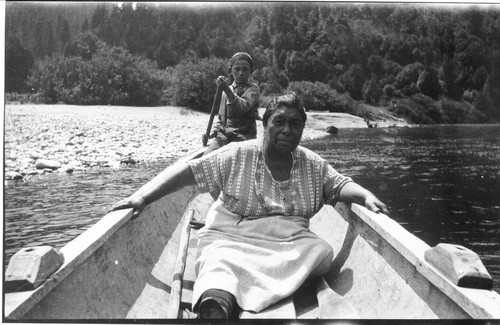 Yurok grandmother in a "double-ender" canoe