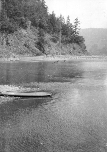 Klamath River scene: "Old-fashioned" canoe along the river bank