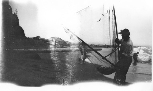 Requa: Ed Spott taking surf fish in an A-frame net