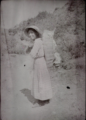 Requa(?): An Indian woman, carrying a baby in a basket, profile