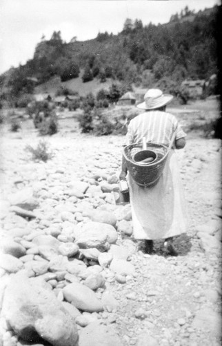 Johnsons: A woman using a shoulder tumpline on Johnsons bar