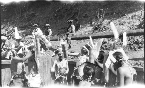 Pecwan: Jump Dance, probably in 1926. Dancing in pit. An early print exists with a pencilled notation in Mrs. Ruth K. Roberts' hand, reading:--Jump dance pit