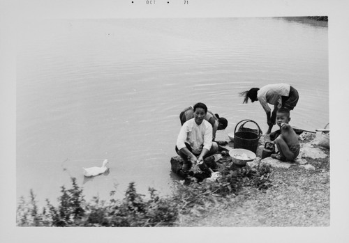 Women Doing Laundry by the Riverside