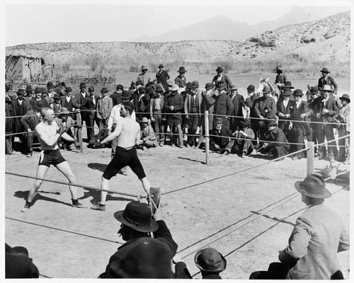 Prize fight in desert country ring, possibly in Juarez, Mexico