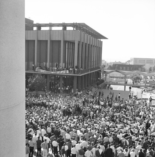 Crowd in Sproul Plaza facing the Student Union and fountain