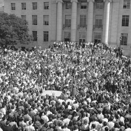 Jackie Goldberg on top of police car in front of Sproul Hall