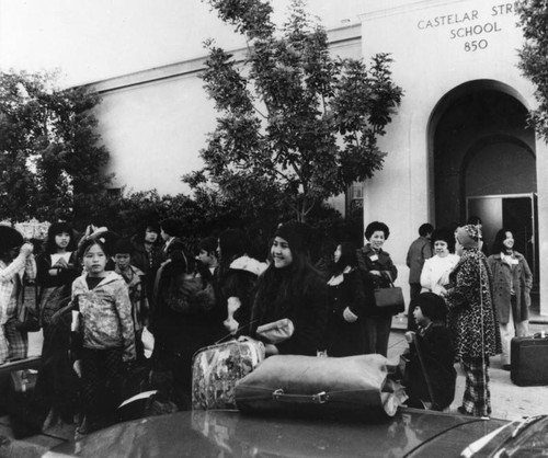 Chinese American students in front of school