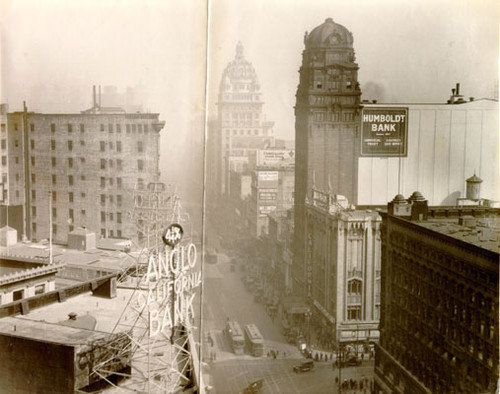 [View east down Market Street, from near 4th Street, showing the top of the Anglo California Bank Building, the Call Building and the Humboldt Bank Building]