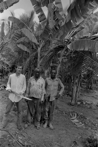 Fermín Herrera, Richard Cross, and another man in the field, San Basilio de Palenque, 1976