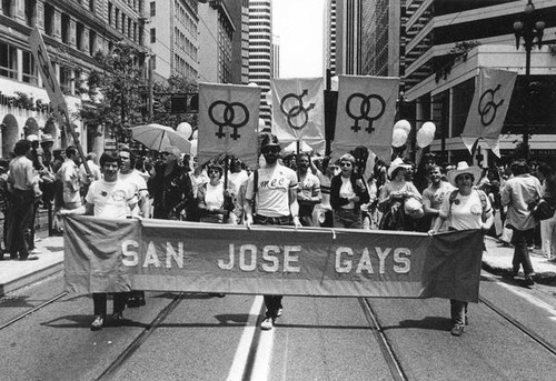 Parade participants carrying a "San Jose Gays" banner