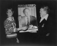 Two men with Harvey Milk poster