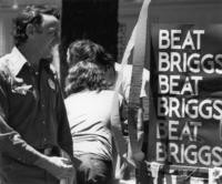 Man next to Beat Briggs banner