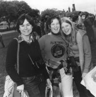 Three smiling women at march