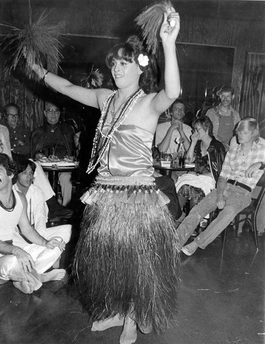 Female impersonator in hula dancer costume