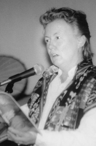 Judy Grann at a microphone