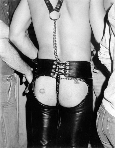 Leather man showing his backside through his chaps