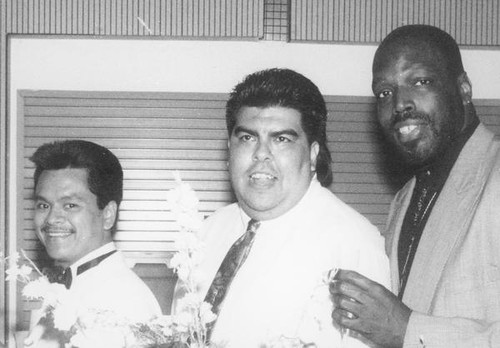 Three men posing together