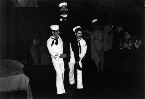 Three men in sailor costumes