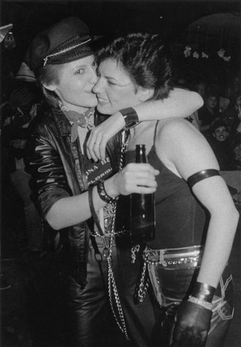 Women in leather hugging