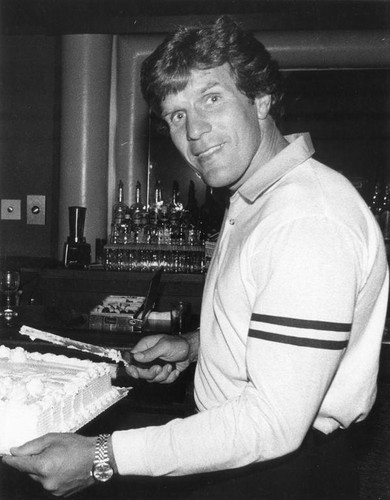 David Kopay cutting a cake