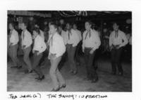 Men line dancing at the Savoy