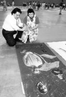 Couple viewing AIDS memorial quilt