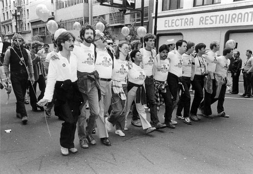 Parade participants wearing "Harvey Milk Gay Democratic Club" T-shirts