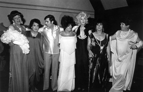 Female impersonators posing for pictures