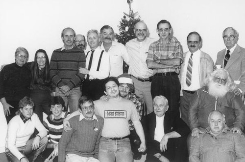Group portrait in front of a Christmas tree