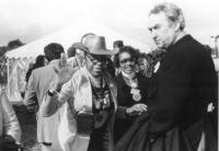 Two women and Phillip Burton at march