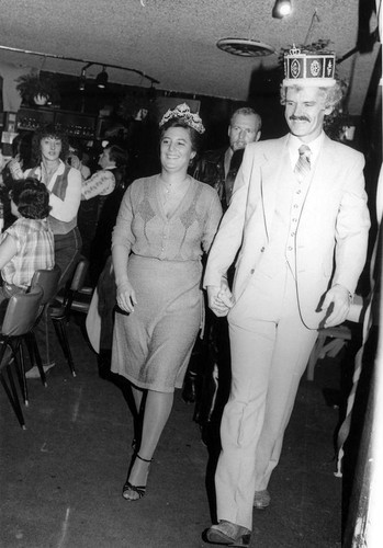 Dennis Andrews and Darlene Lutz wearing their crowns