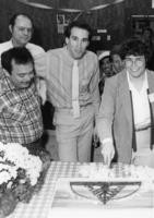 Liz Burkhouse cuts cake at the Billy DeFrank Center's fourth anniversary