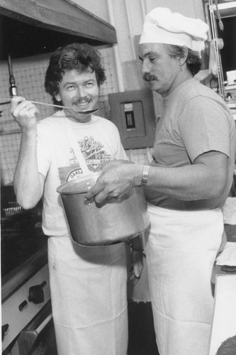 Owners in their restaurant's kitchen