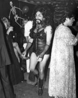 Female impersonator in leather corset