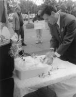 Man cutting cake