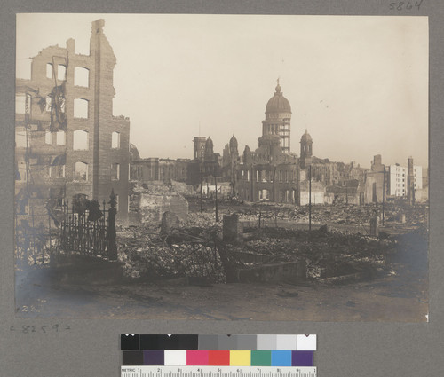 [Ruins and debris. City Hall in background.]