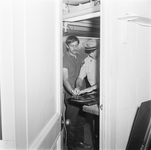 Jack Weinberg fingerprinted by Sgt. Joseph Halloran