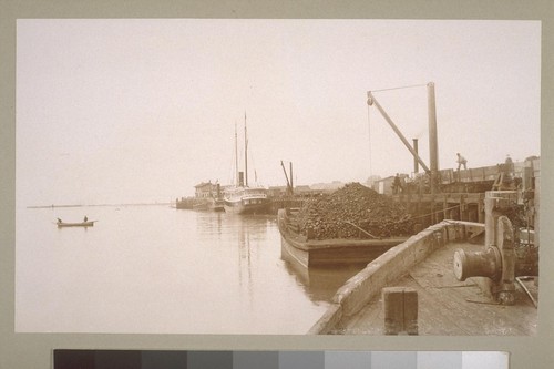 [Barge and tug boat at dock]