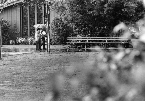 Students walking by university chapel