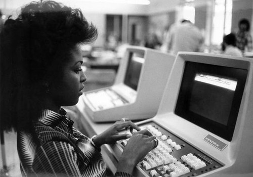 La Rosa Carrington typing on a Spartan Daily Video Display Terminal