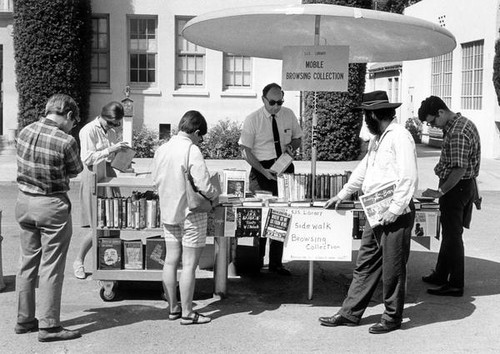 Jack Douglas working at the mobile book stand