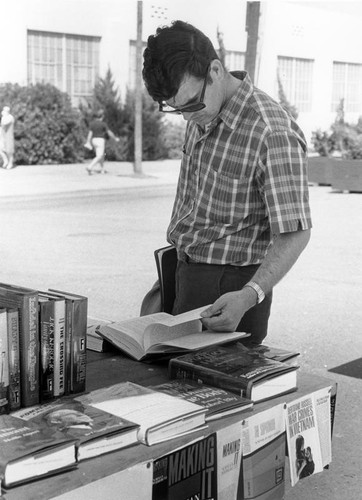 Student browsing through a book