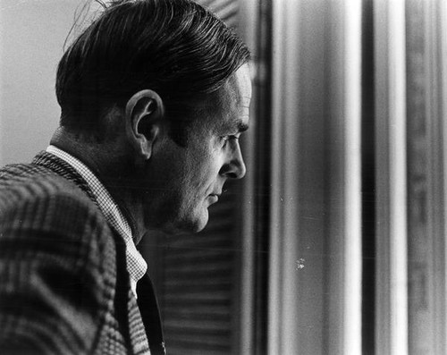 John Bunzel looking out a window