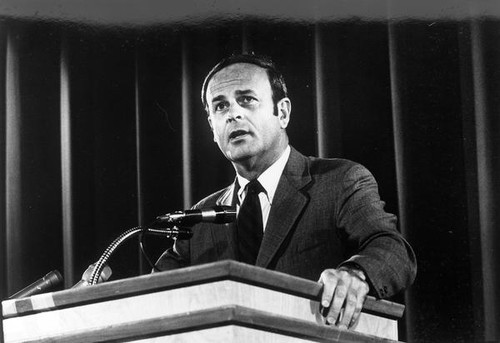 John Bunzel giving a speech — Calisphere