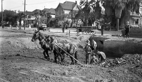 Men digging a ditch