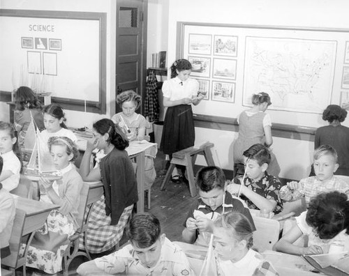 School children building boats