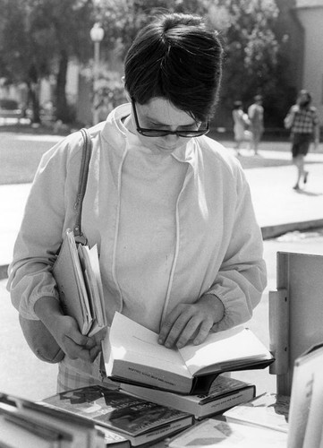 Female student browsing books