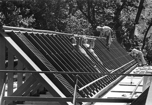 Students preparing roof for solar panels